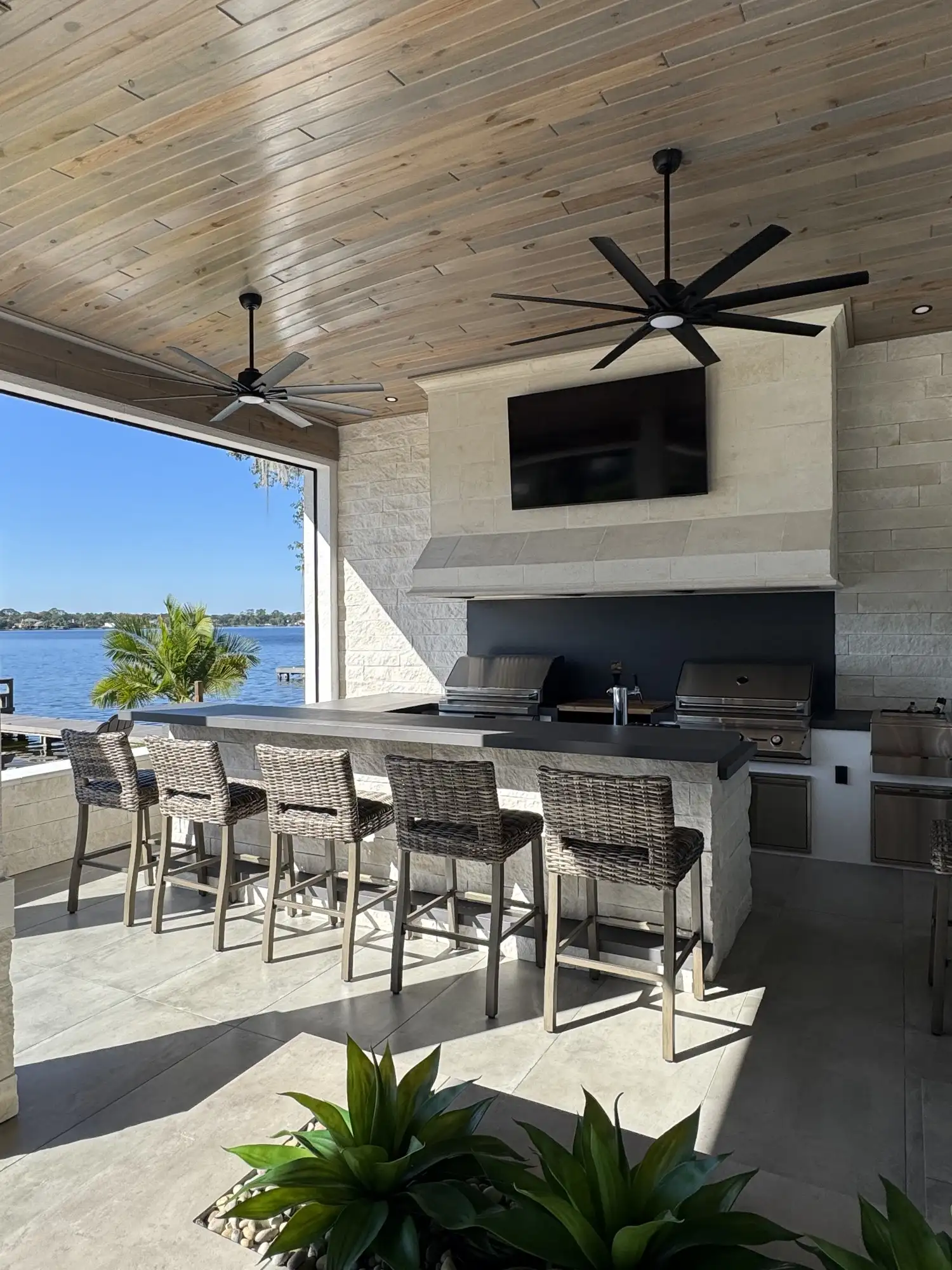 Waterfront outdoor kitchen with ventilation hood in Apopka, FL