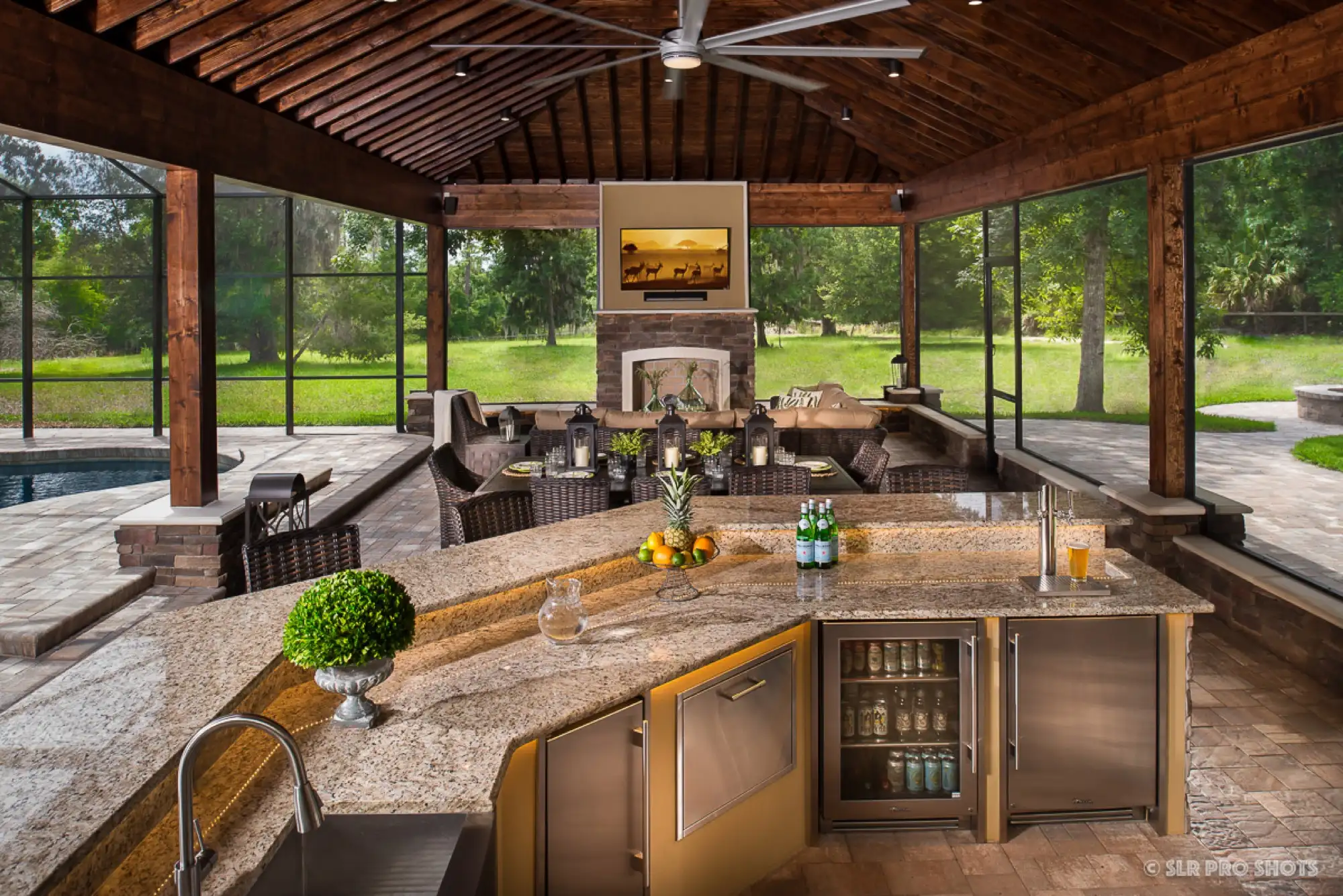 The finished outdoor kitchen and bar with stone veneer in Geneva, FL